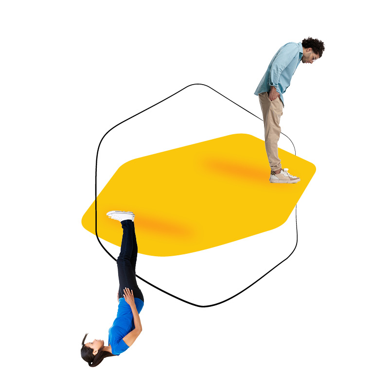 A man stands and a woman hangs upside-down on a yellow shape.
