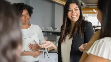 Group of professionals having a meeting in an office setting.