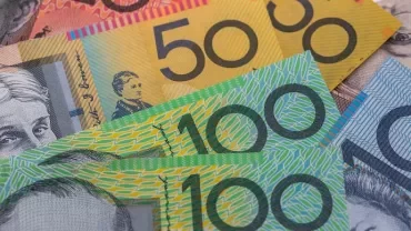 Australian banknotes in various denominations displayed in a fan.