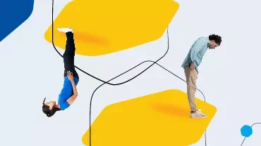 Person upside down, another standing on abstract yellow shapes.
