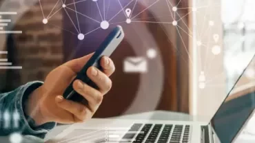 Man looking at laptop futuristic graphics