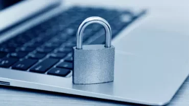 Padlock on a laptop keyboard symbolizing data security.