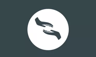 Symbol of two hands reaching toward each other on a circular background.