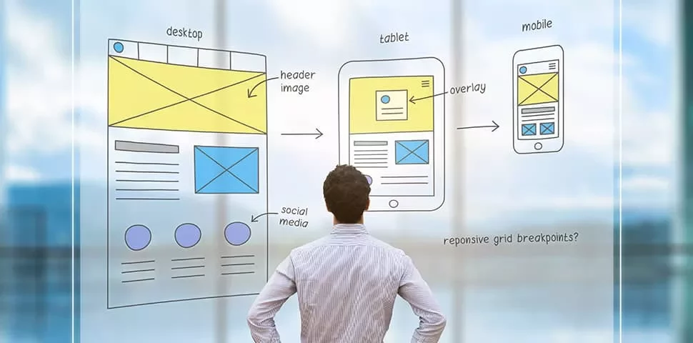 Person looks at design sketches on transparent board.