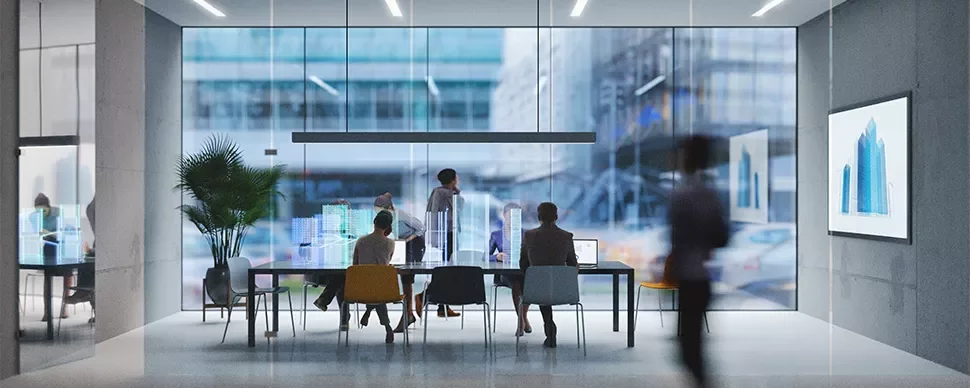People in a modern office with glass walls during a meeting.