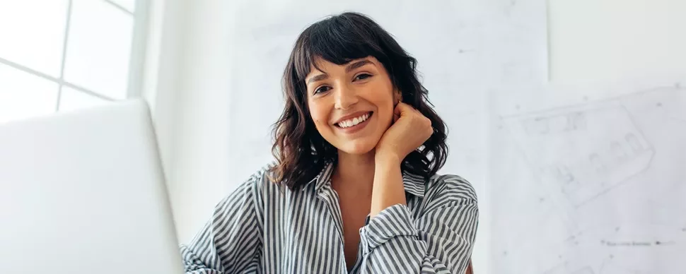A professional woman smiling.