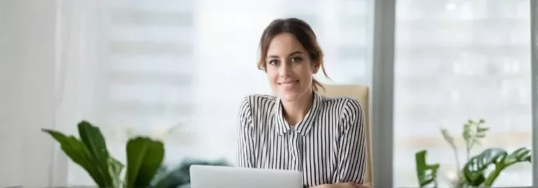 A professional smiles showing confidence in asking for a pay rise