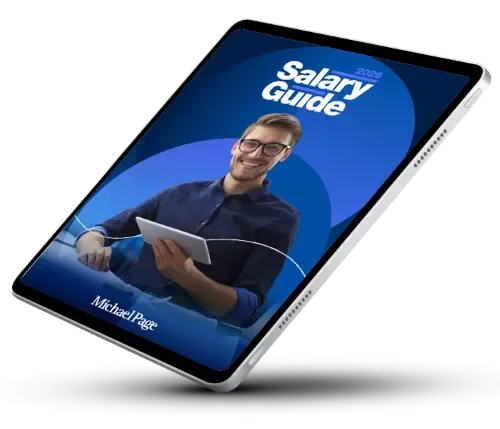 Man smiling holding a tablet