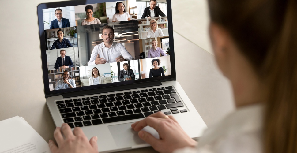 A woman on a video call meeting with people of different ethnicities