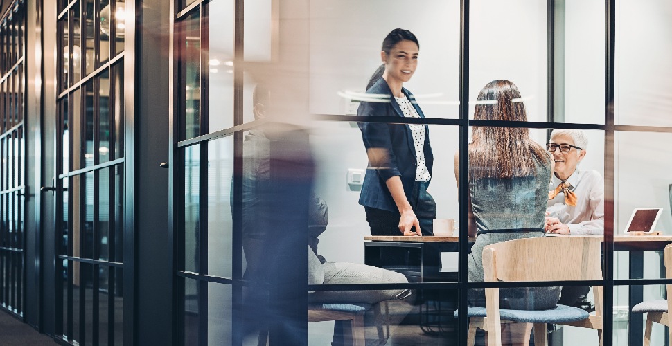 Female employees of different age groups working together in the office